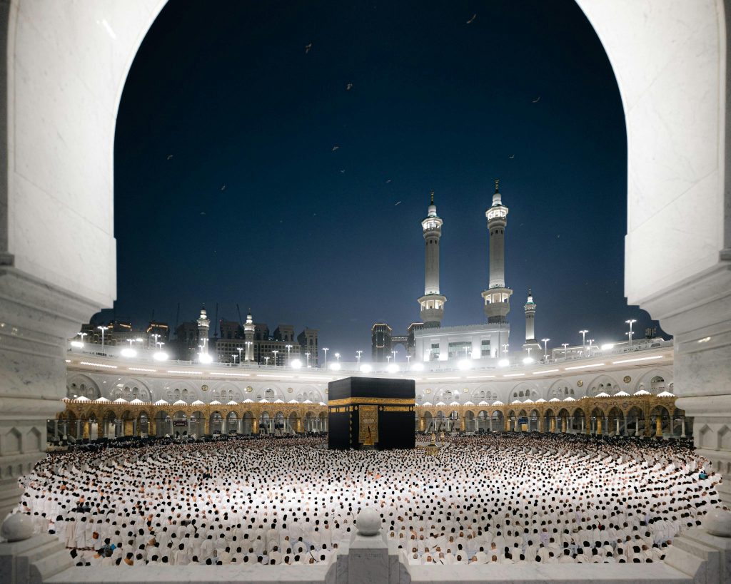 A breathtaking night view of pilgrims at the Kaaba in Masjid al-Haram, Makkah, Saudi Arabia.